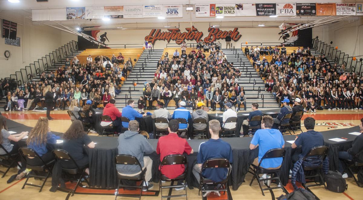 LINK: Students sign on dotted line