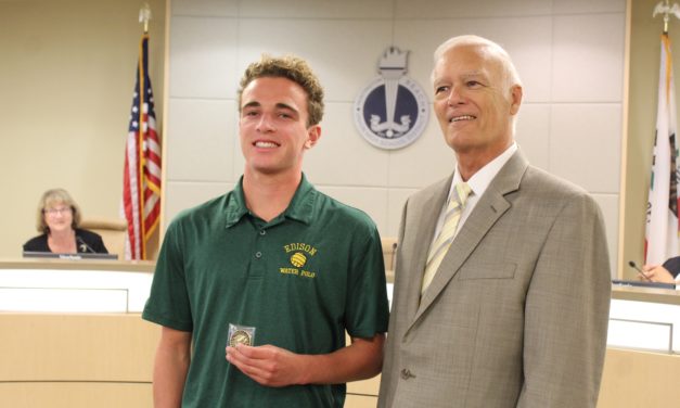 Board of Trustees honors student for his selfless swimming for school supplies